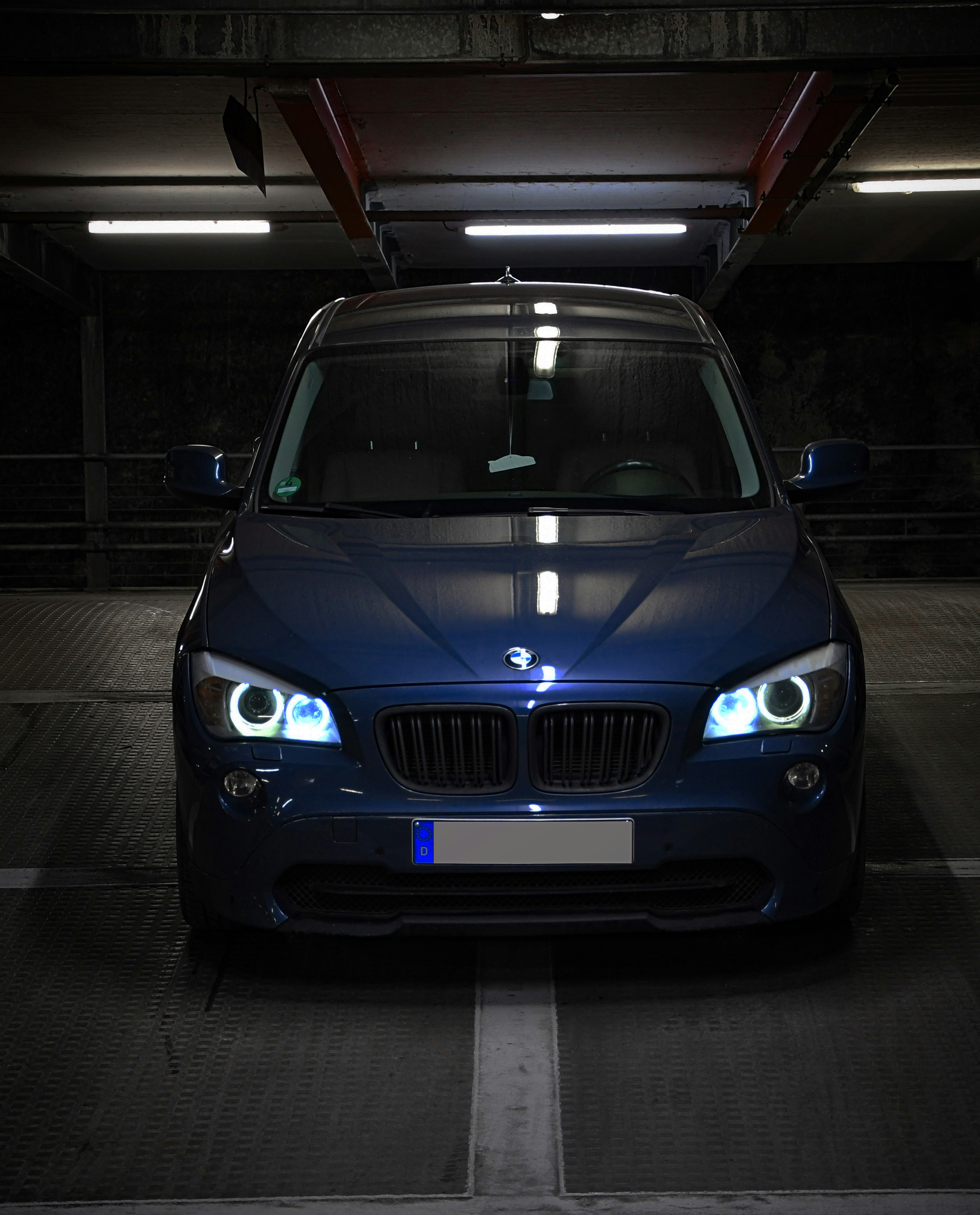 blue bmw car in garage